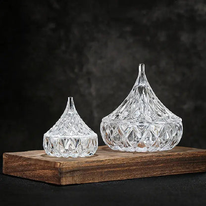 Elegant airtight glass tea canister with lid, side view on wooden surface