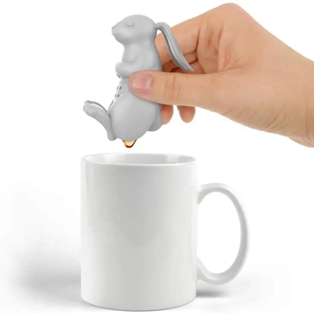Rabbit tea infuser on a saucer with tea cup