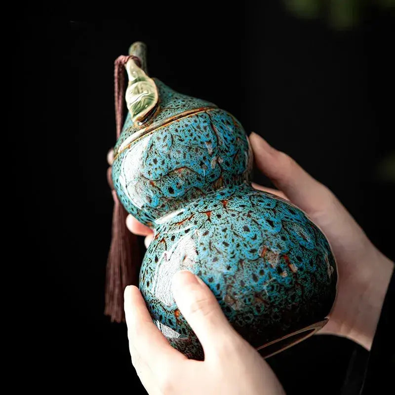 Gourd-shaped ceramic tea canister with close-fit airtight lid, side view
