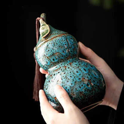 Gourd-shaped ceramic tea canister with close-fit airtight lid, side view