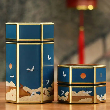 Close-up of painted tea tin lid showing traditional Chinese floral design