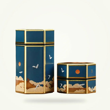 Decorative tea storage tin with Chinese painting design, packshot on plain background