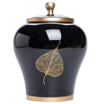 Ceramic tea canister with airtight lid open, showing loose leaf tea inside