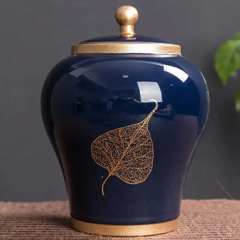 Marine blue ceramic tea canister with airtight lid and botanical painted motif