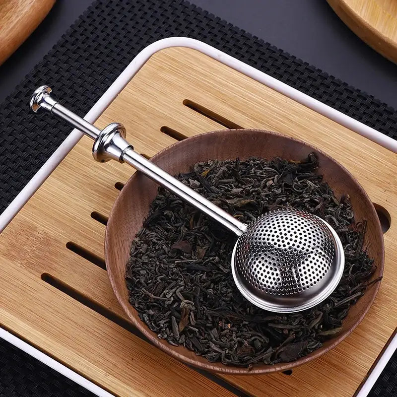 Design tea infuser with drip tray and lid
