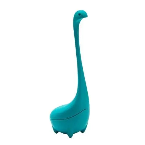 Blue dinosaur loose leaf tea infuser sitting on mug rim