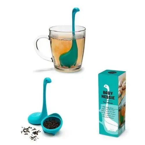 Dinosaur loose leaf tea infuser with steam rising from hot mug