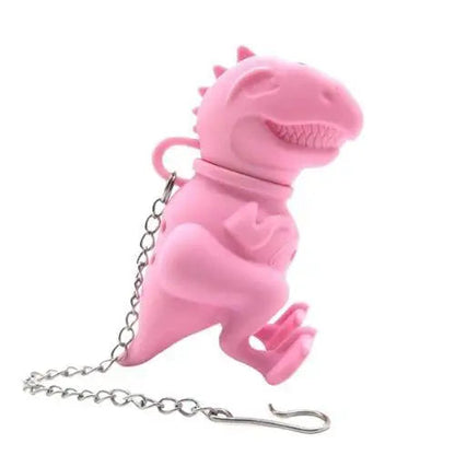 Pink dinosaur silicone tea infuser for loose leaf tea on white mug