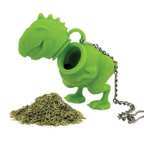 Dinosaur tea infuser filled with loose leaf tea inside mug