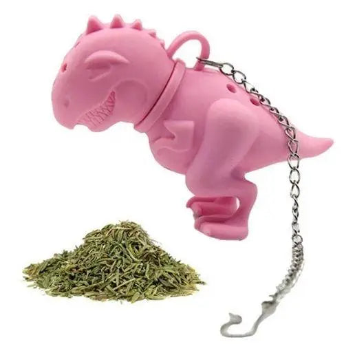 Dinosaur tea infuser submerged in cup of steeping loose leaf tea