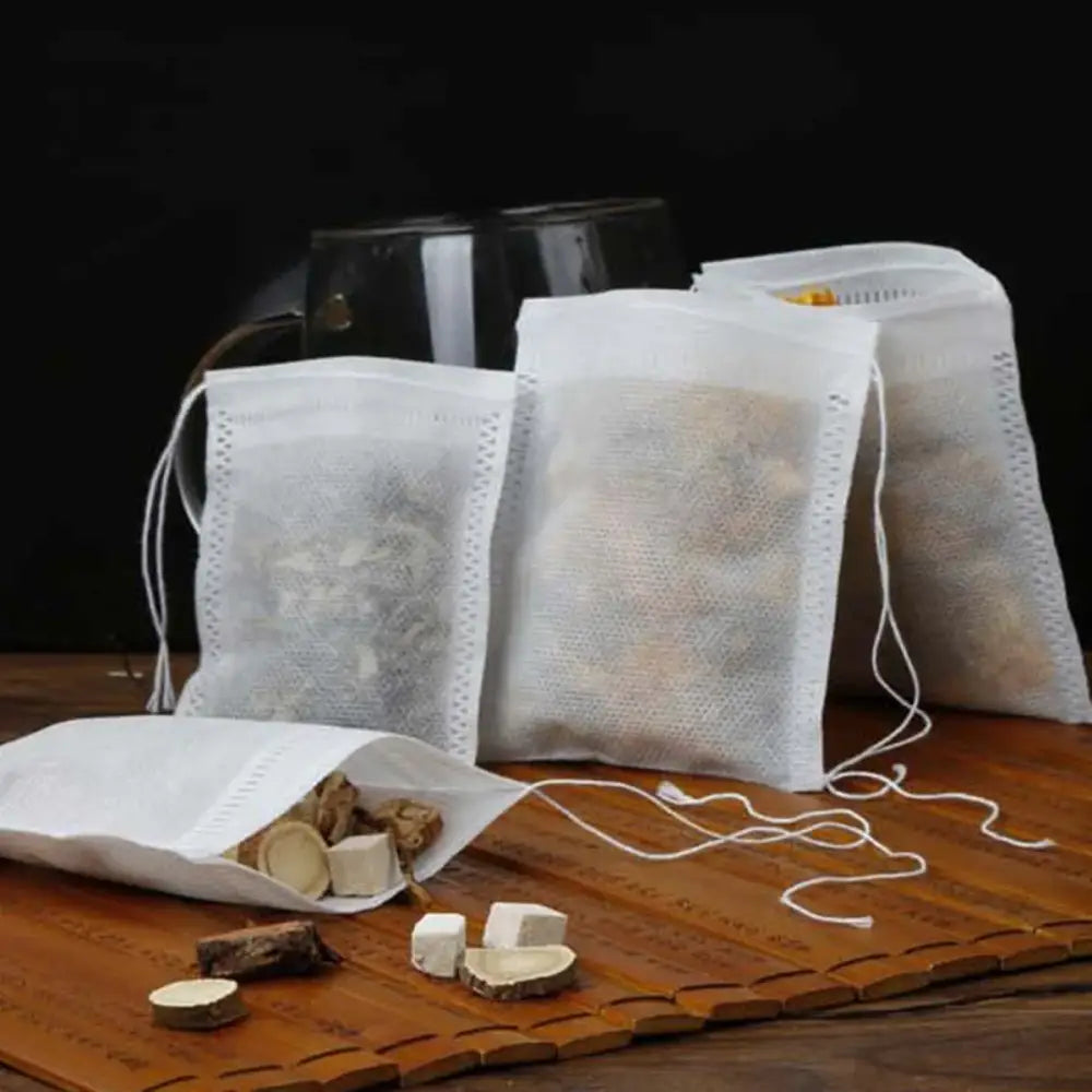 Five sizes of drawstring tea filter bags laid side by side, 6x8 to 10x15 cm