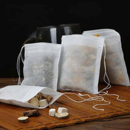 Five sizes of drawstring tea filter bags laid side by side, 6x8 to 10x15 cm