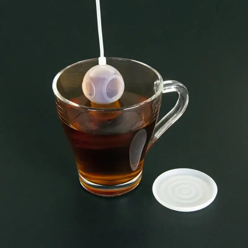Diver tea infuser floating in a cup of tea