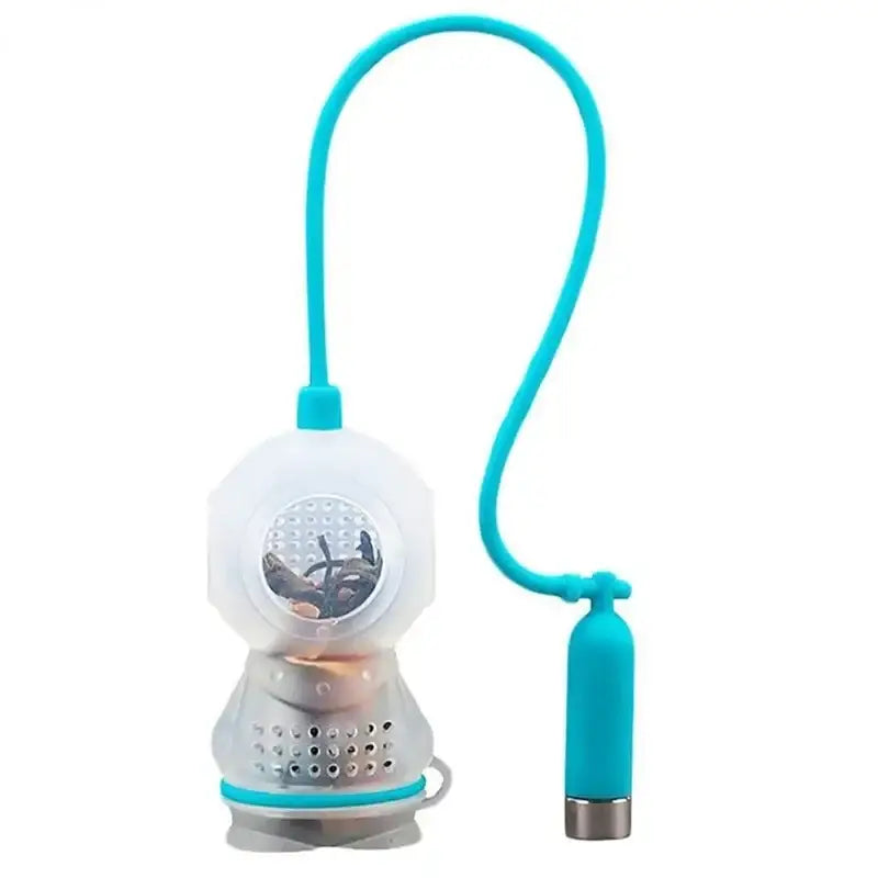 Diver tea infuser with loose leaf tea beside it