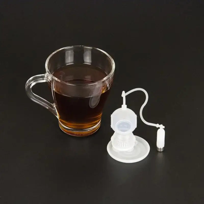 Diver tea infuser in a mug with steam rising