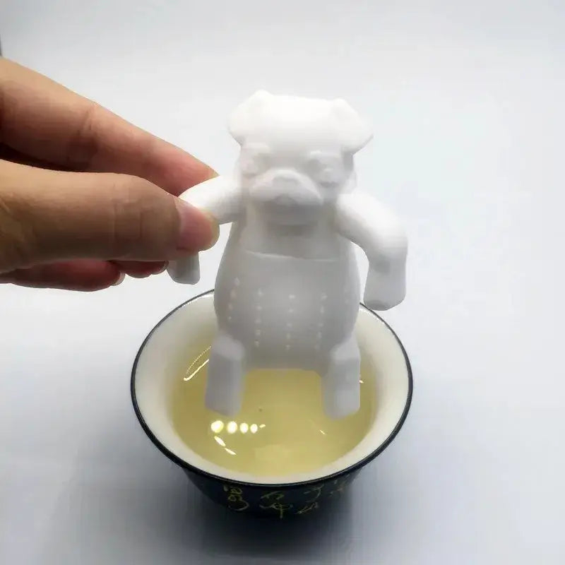 Dog tea infuser with steam rising from mug