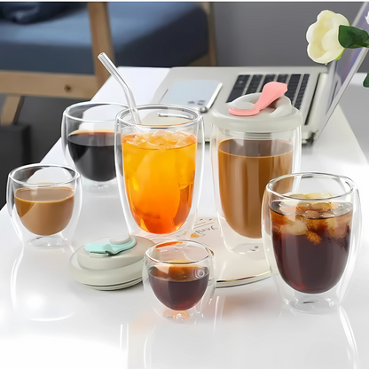 Six double wall glass tea cups arranged together showing clear glass construction