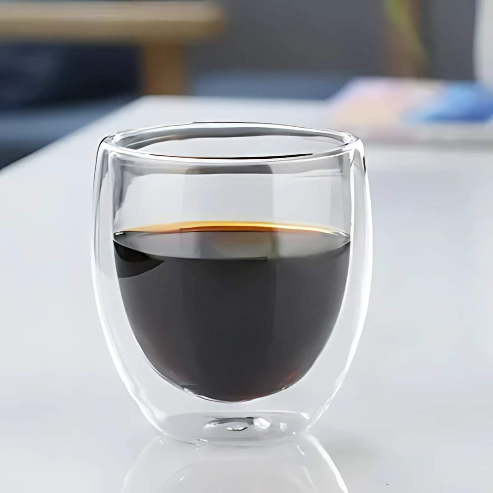 Double wall glass tea cups with green tea, showing color through clear borosilicate