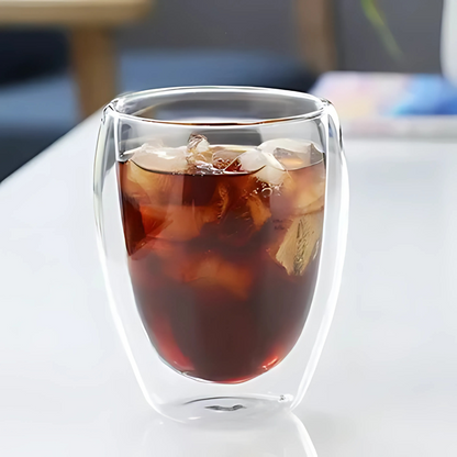 Hand holding a double wall glass tea cup, cool outer wall demonstration