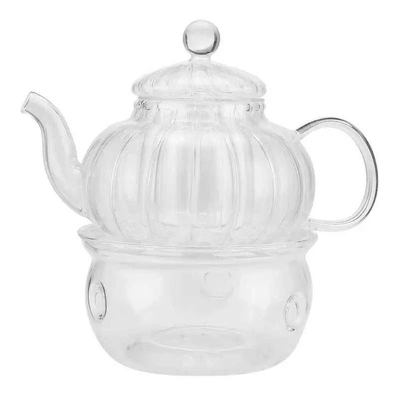Pumpkin-shaped double wall glass teapot on a wooden table, side view
