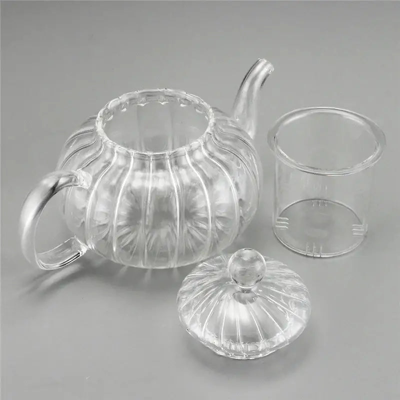 Pouring tea from 600ml double wall glass teapot into a double wall glass cup