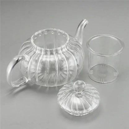 Pouring tea from 600ml double wall glass teapot into a double wall glass cup