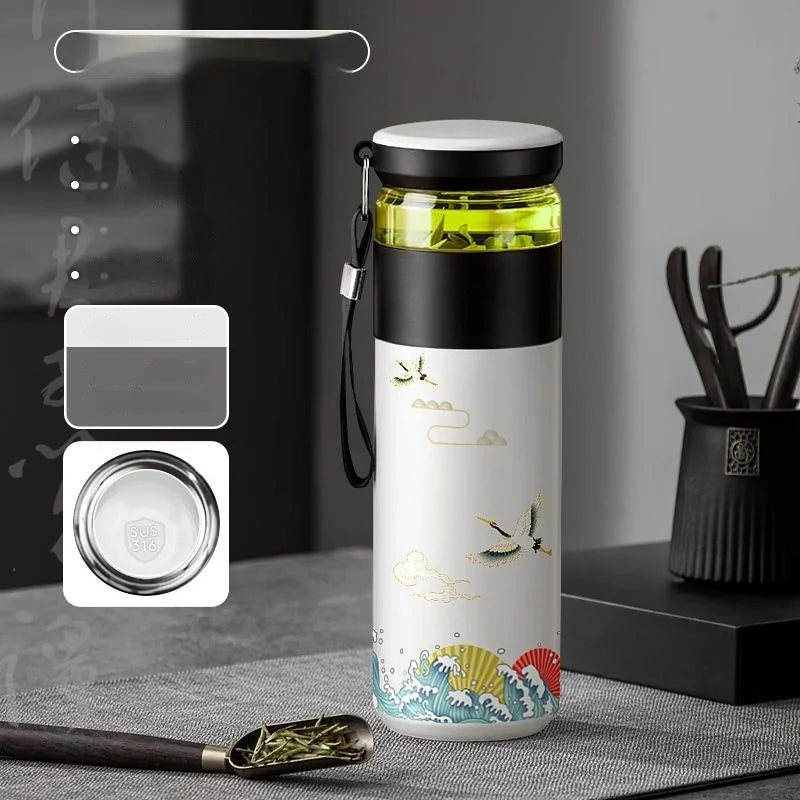 Open lid of 500ml insulated tea thermos showing removable stainless steel infuser basket inside