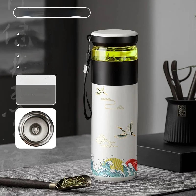 Pouring hot loose leaf tea from double wall insulated thermos bottle with infuser, 500ml