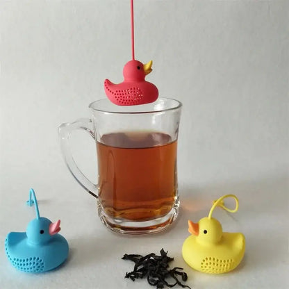 Duck tea infuser being filled with tea leaves