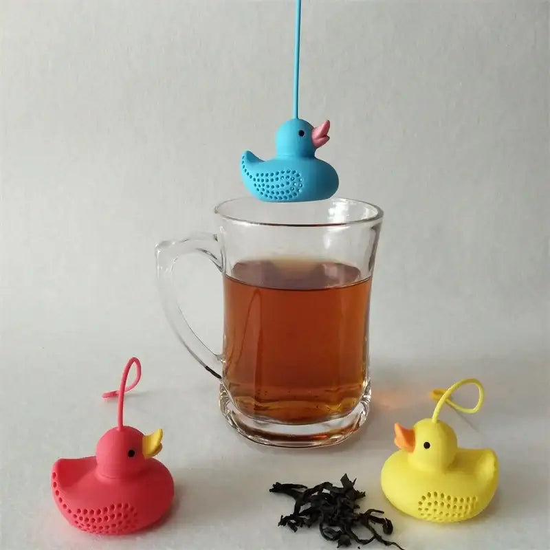 Duck tea infuser in a teapot with steam