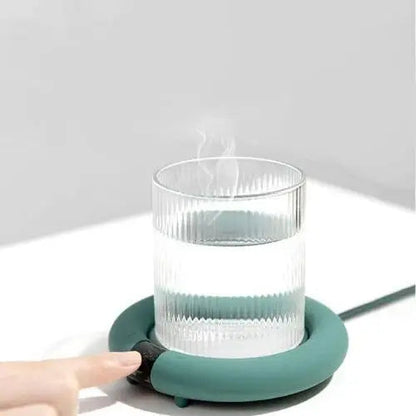 Electric cup warmer keeping tea warm on desk