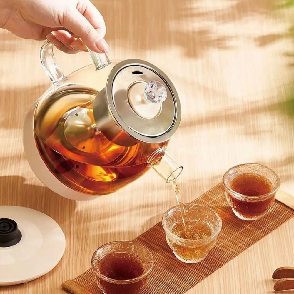 Electric glass teapot with stainless steel infuser basket removed, 1L capacity visible