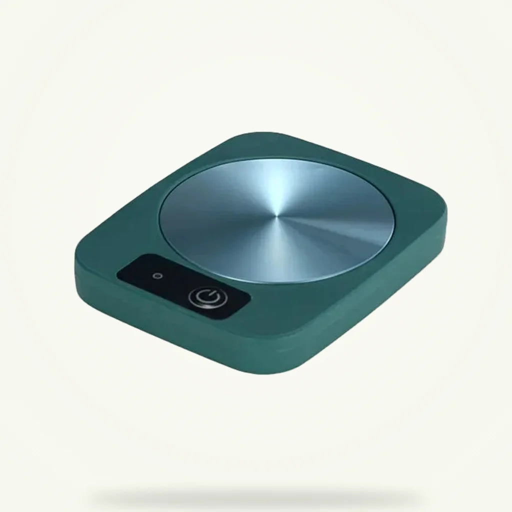 Electric mug warmer heating plate in rose color, product packshot on plain background
