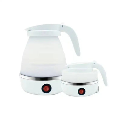 Compact 0.6L electric kettle on kitchen counter beside a teapot