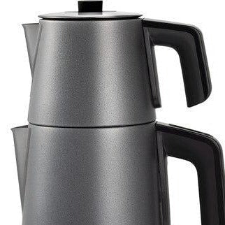 Electric Turkish teapot with loose leaf black tea and sugar cubes for authentic çay