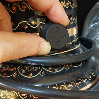 Thermostat control dial on electric Turkish teapot copper finish