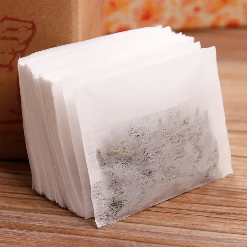 Close-up of empty tea bag with drawstring, corn fiber material