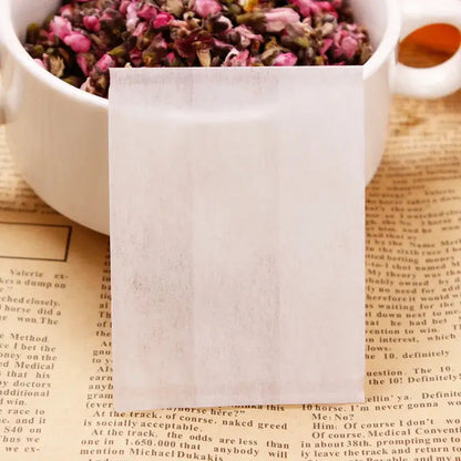 Tea bag filled with loose leaf tea, drawstring closed