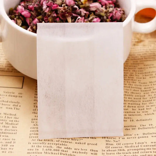 Tea bag filled with loose leaf tea, drawstring closed