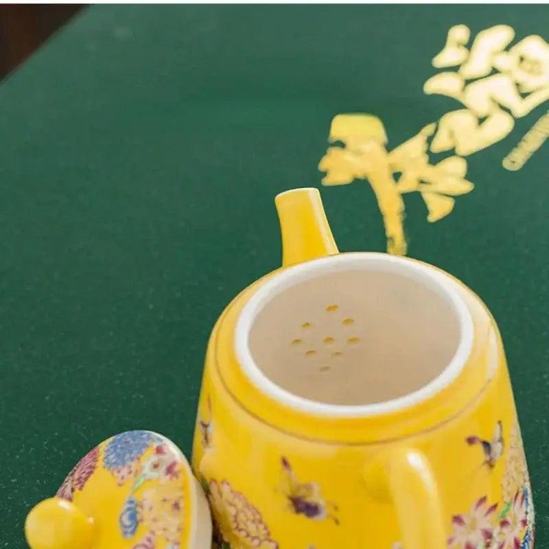Close-up of ceramic teapot spout and handle