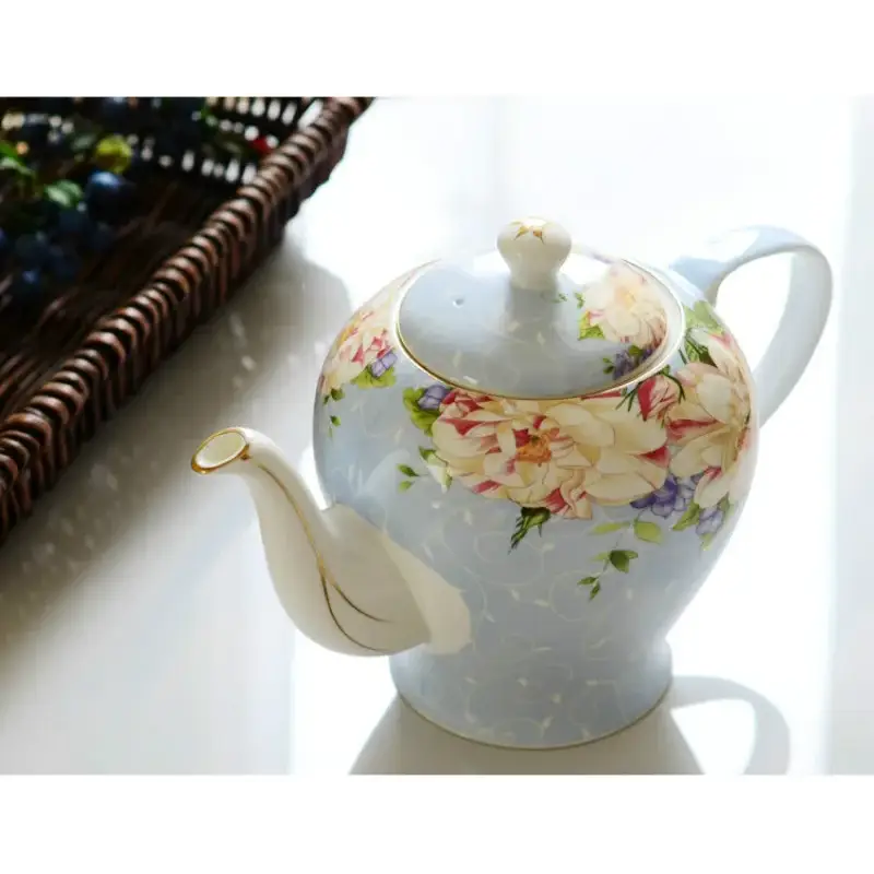 Elegant English ceramic teapot with floral background
