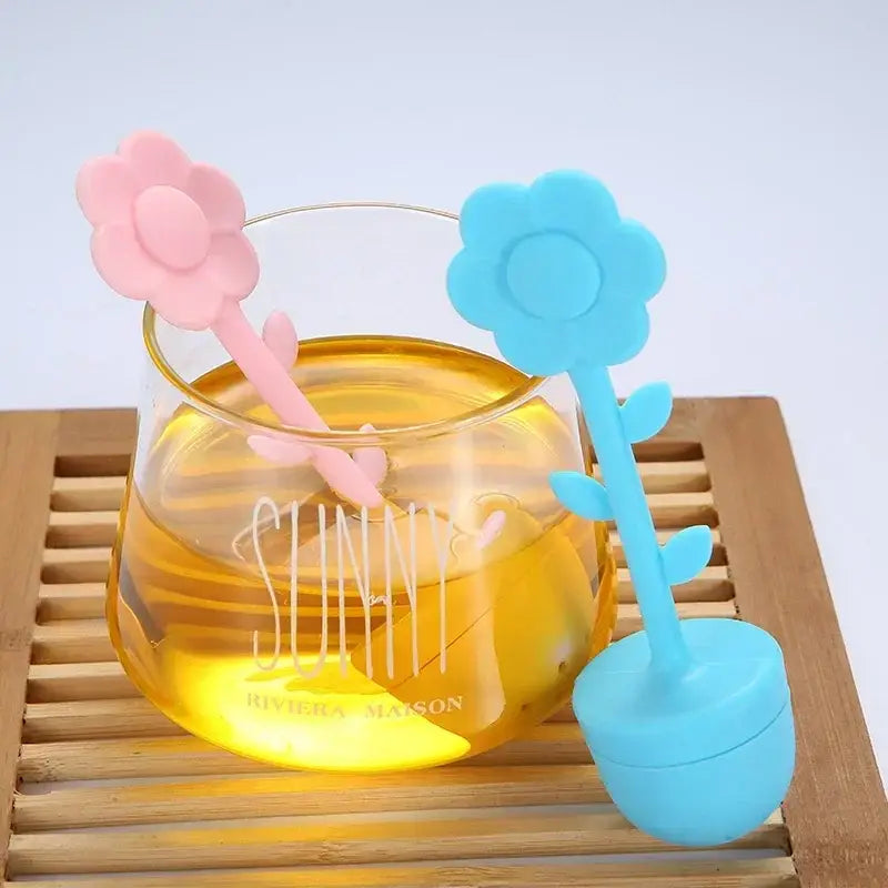 Flower tea infuser steeping in a white mug