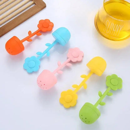 Colorful flower tea infusers in blue, green, pink