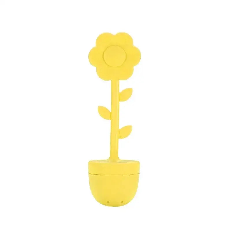 Yellow flower tea infuser on a saucer