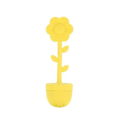 Yellow flower tea infuser on a saucer