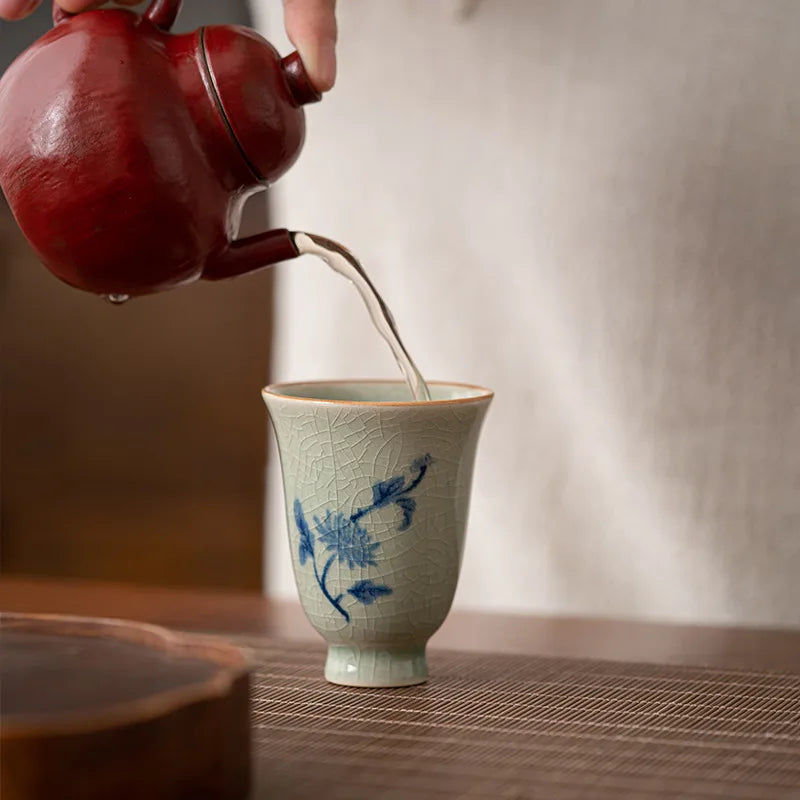 Plum blossom porcelain tea cup from the Four Gentlemen boxed set side view