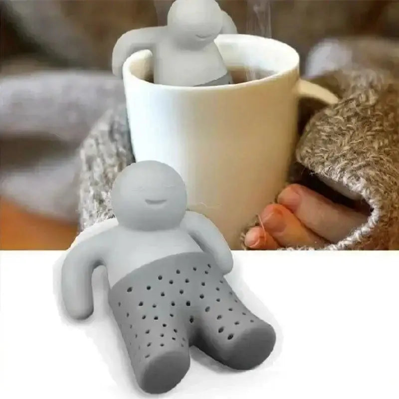 Silicone tea infuser with a smiling face on a cup