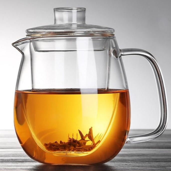 Scandinavian glass teapot 1200ml poured next to white tea cup