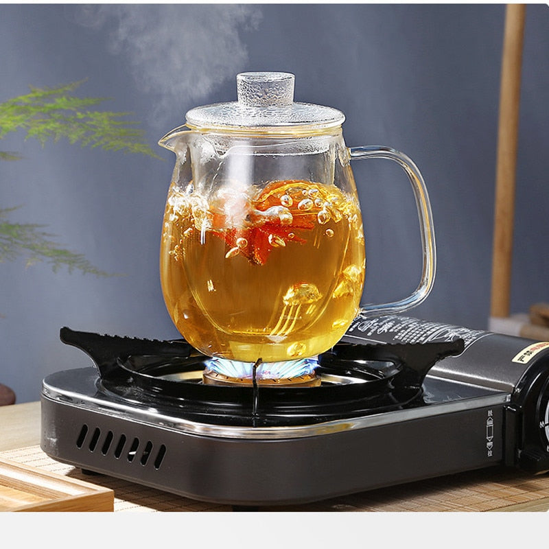 Clear borosilicate glass teapot with loose-leaf tea inside infuser