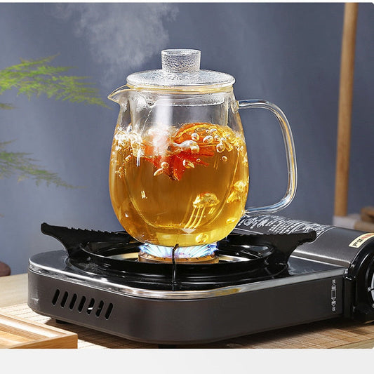 Clear borosilicate glass teapot with loose-leaf tea inside infuser